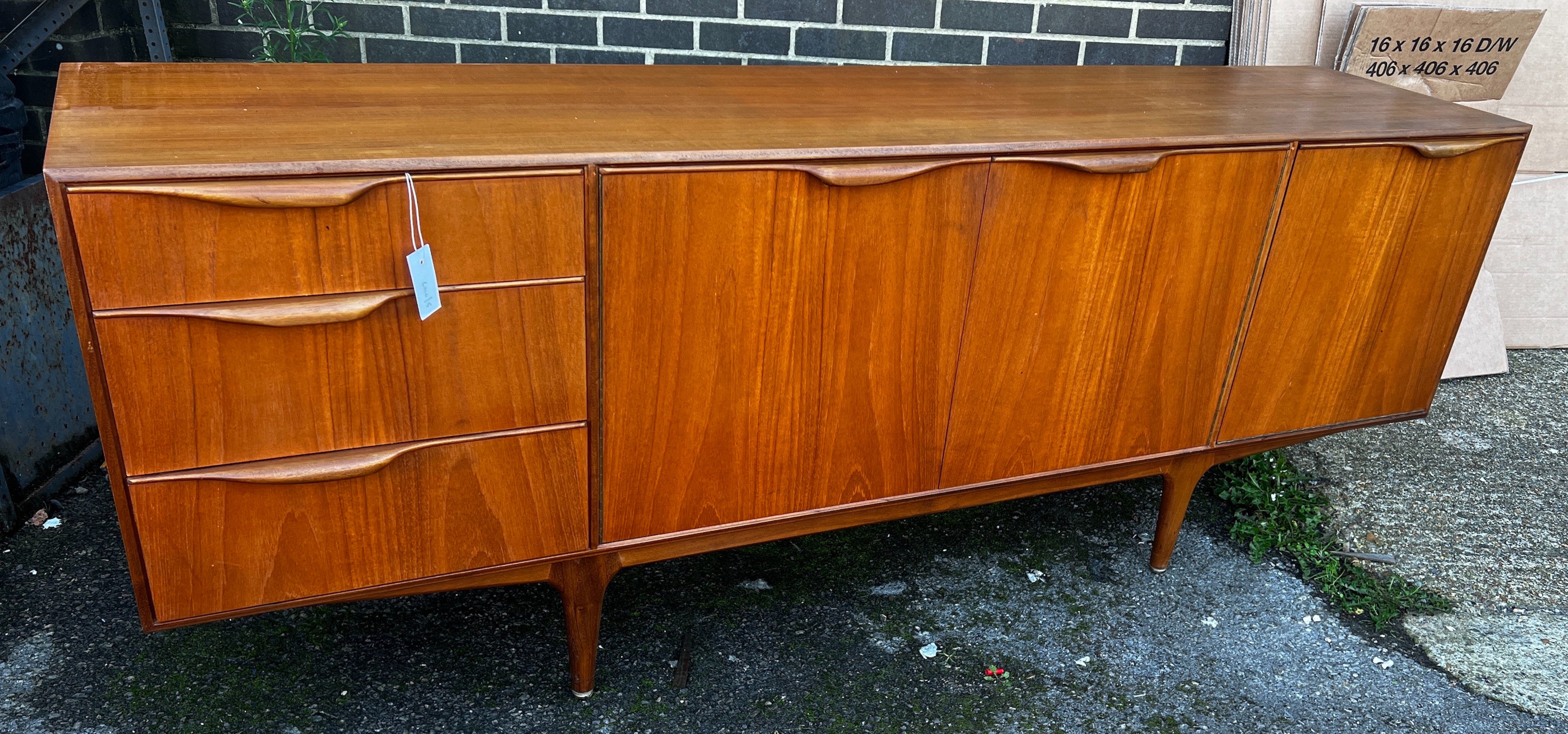 A. H. McIntosh & Co. A Dunvegan teak sideboard designed by Tom Robertson, length 201cm, depth 48cm, height 76cm